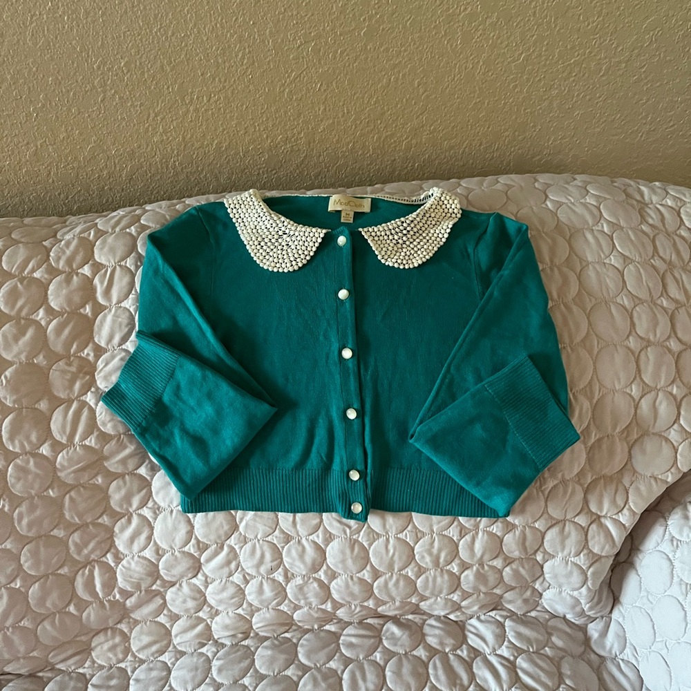 Mod cloth cropped sweater.  Long sleeves.  Pearl buttons